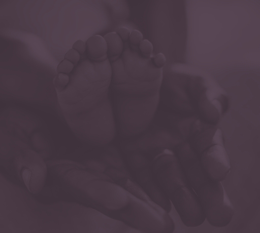 baby feet being held by someones hands