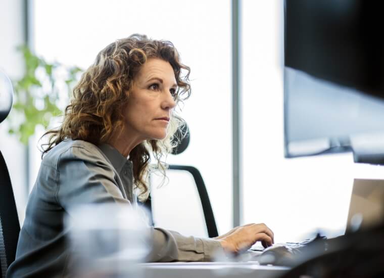 woman working on her computer at the office