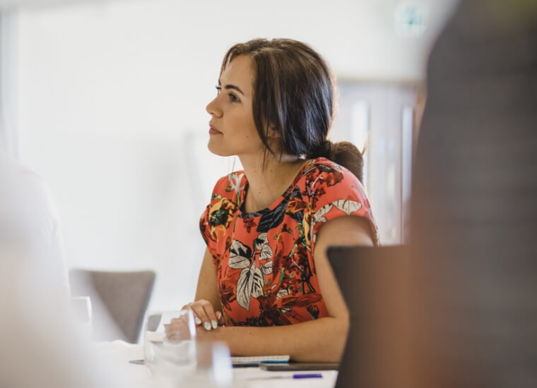 woman wearing an orange floral shirt